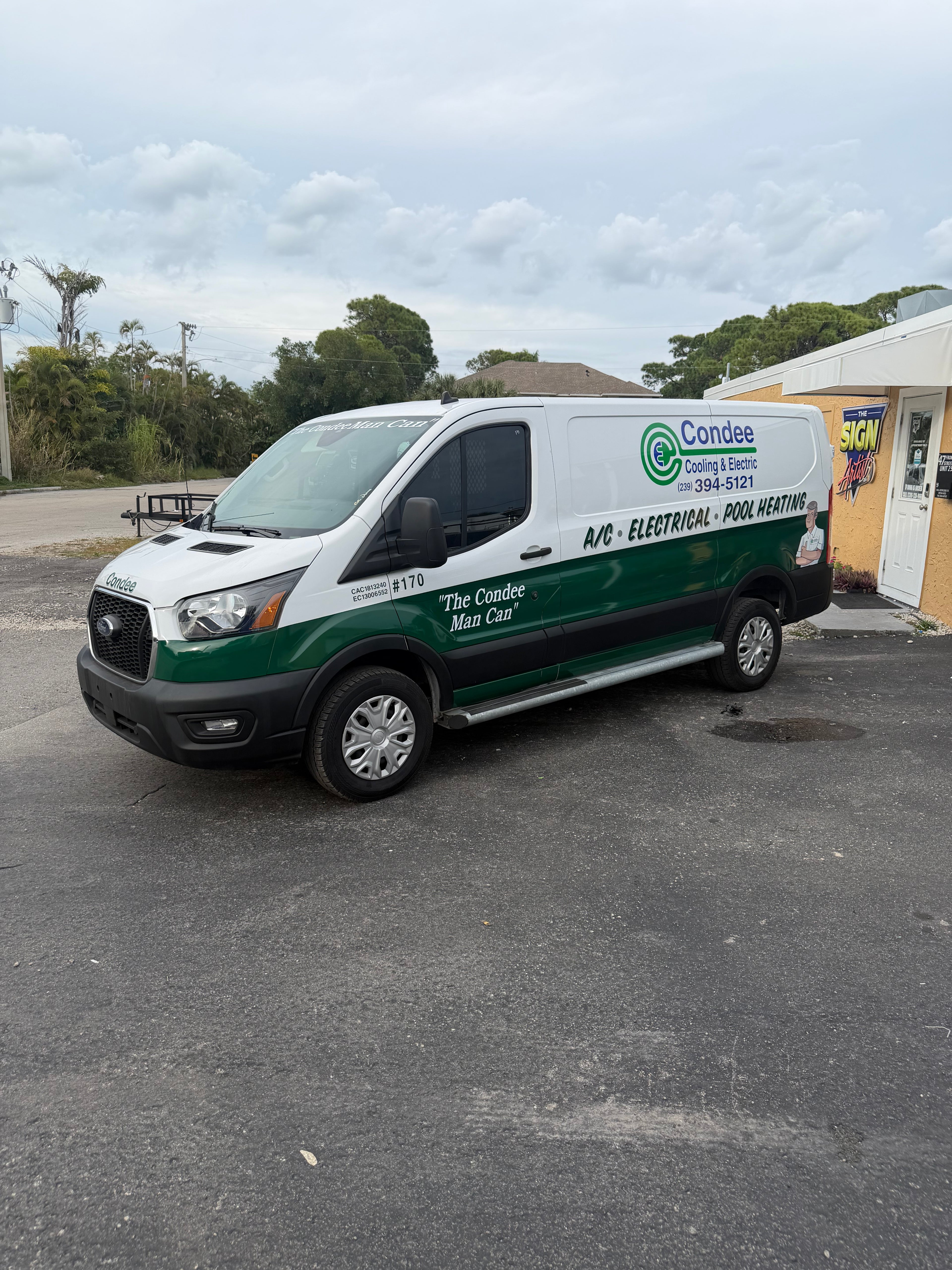 Van with Condesarost Heating & Cooling branding parked on a street.
