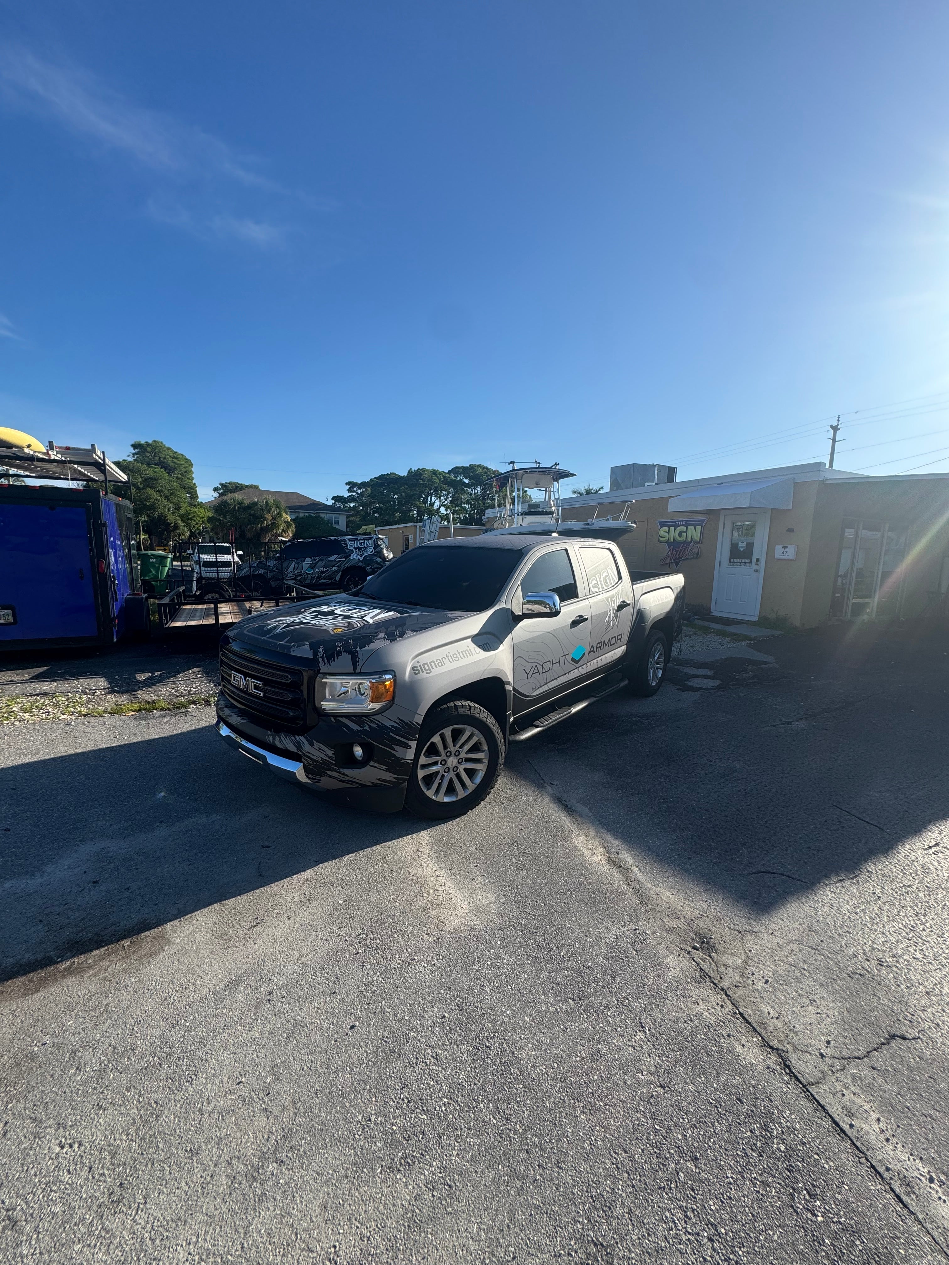 Car parked on a street with a clear blue sky